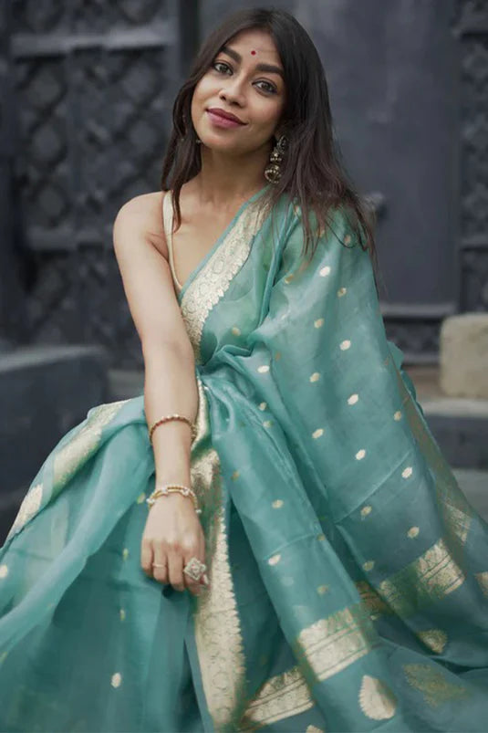 Moiety Turquoise Banarasi Silk Saree With Panoply Blouse Piece